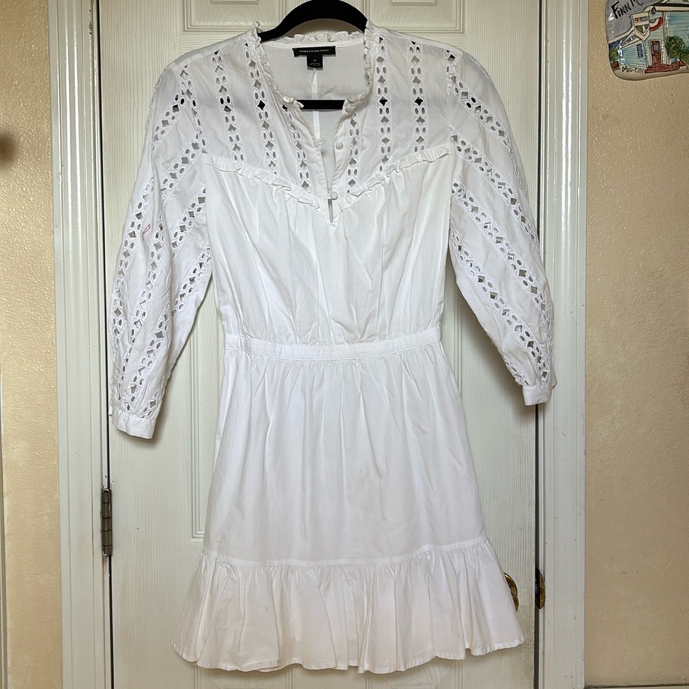 White lace long-sleeve dress with ruffle hem